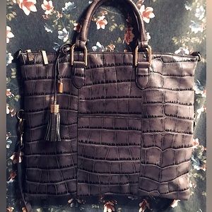 G.I.L.I. crocodile leather bag with tassel shoulder strap.